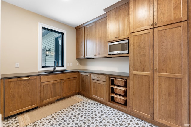 kitchen with sink and stainless steel microwave