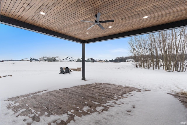 yard layered in snow featuring ceiling fan