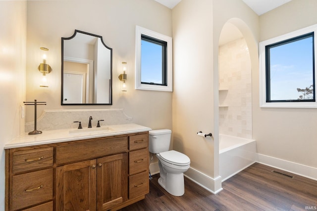 full bathroom featuring vanity, toilet, shower / tub combination, and wood-type flooring