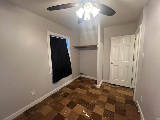 unfurnished bedroom with a closet and ceiling fan