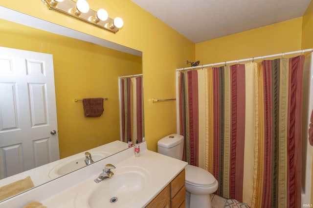 bathroom featuring vanity, toilet, and a shower with shower curtain