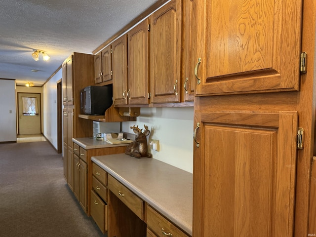 kitchen featuring a textured ceiling