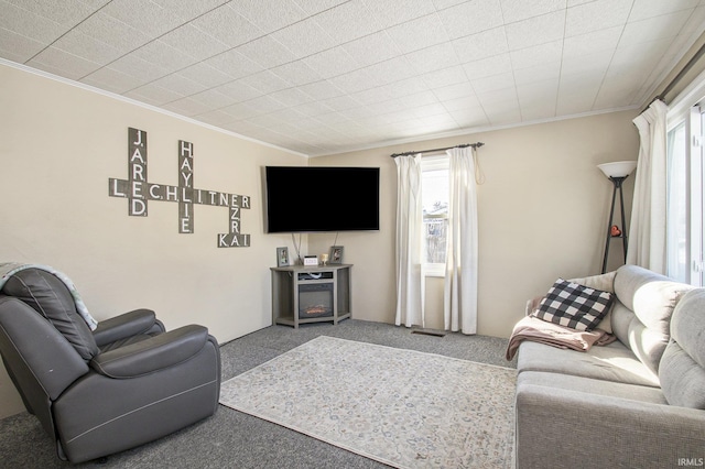 carpeted living room with plenty of natural light and ornamental molding