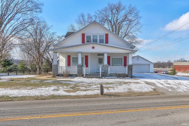 view of front of property with covered porch and a garage