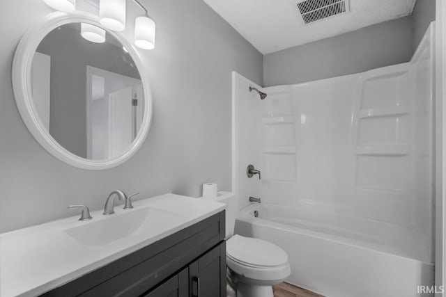 full bathroom featuring shower / bath combination, toilet, and vanity