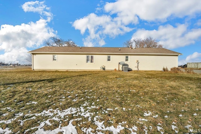 rear view of house with a lawn