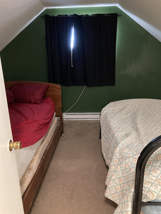 carpeted bedroom with vaulted ceiling and a baseboard heating unit