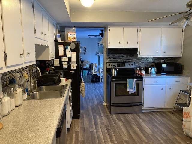 kitchen with appliances with stainless steel finishes, sink, white cabinets, and ceiling fan