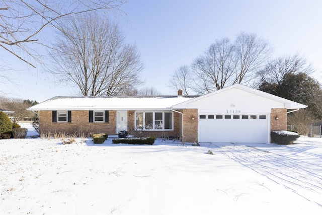 ranch-style house featuring a garage