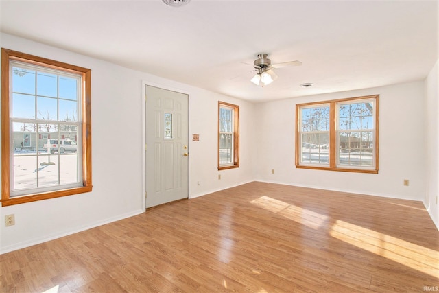 entryway with light hardwood / wood-style flooring and ceiling fan