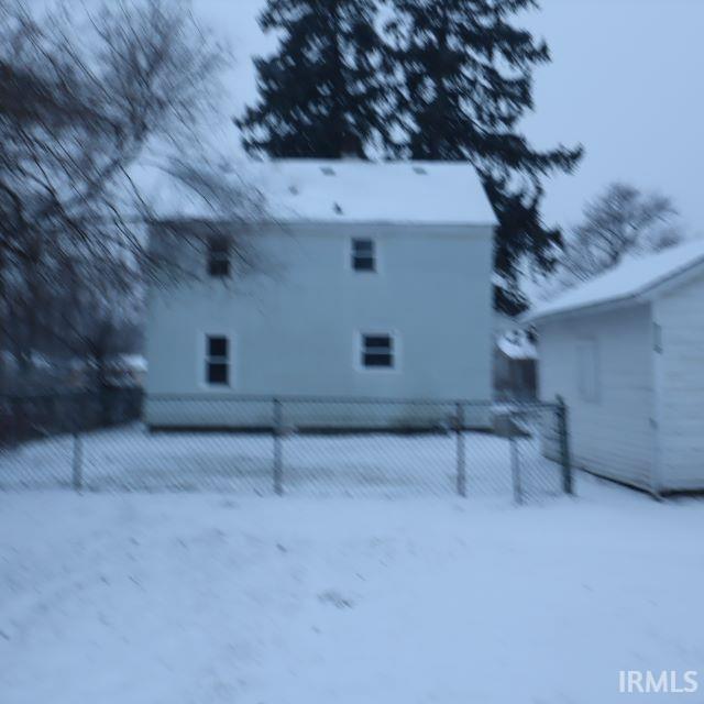 view of snow covered property