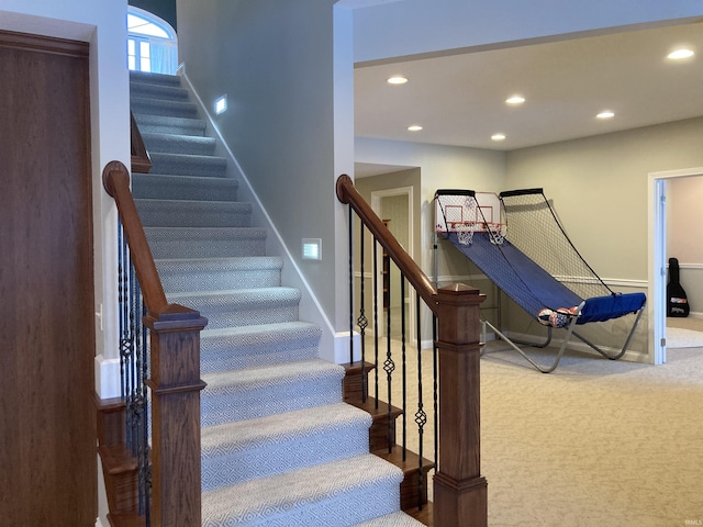 stairs featuring recessed lighting, baseboards, and carpet