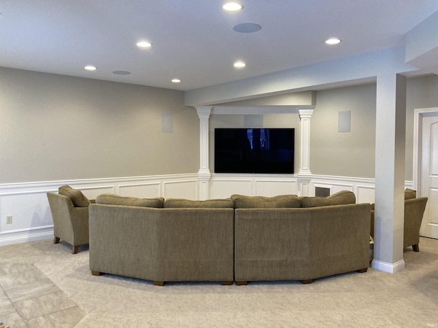 living room with light carpet, recessed lighting, and wainscoting