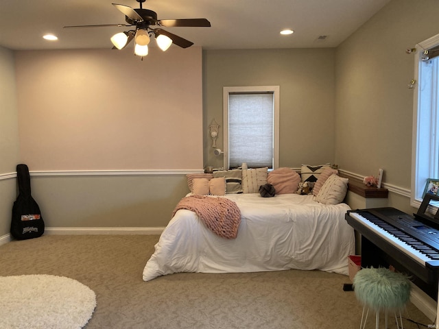 carpeted bedroom with a ceiling fan, recessed lighting, and baseboards