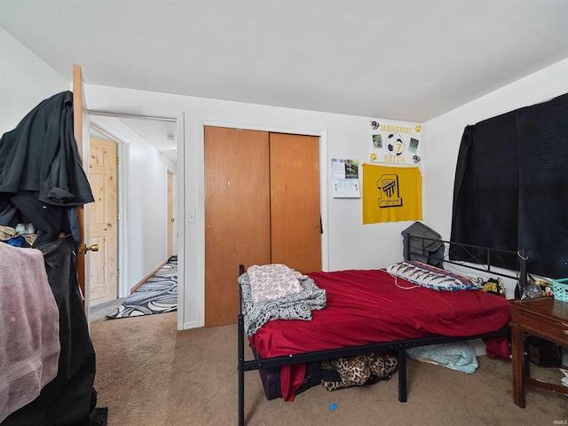 carpeted bedroom featuring a closet