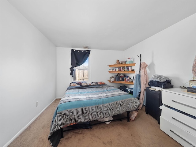 bedroom featuring light colored carpet