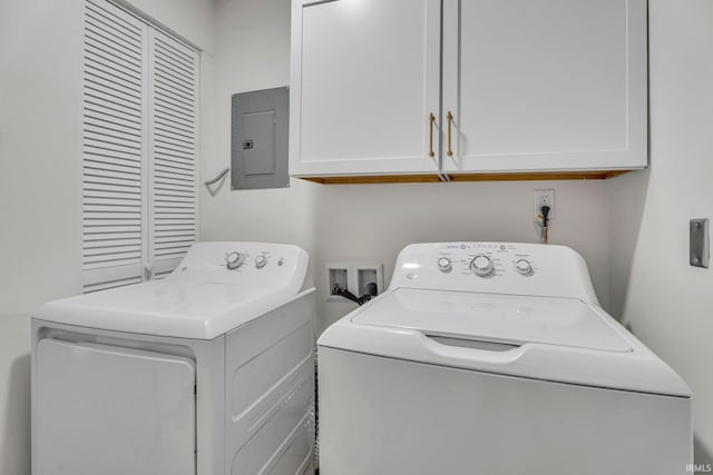 clothes washing area with cabinets, electric panel, and washing machine and clothes dryer