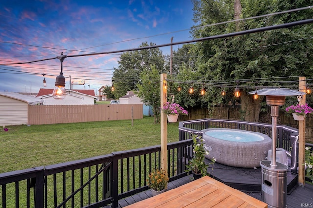 deck at dusk with a lawn