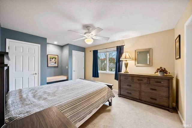 carpeted bedroom featuring ceiling fan