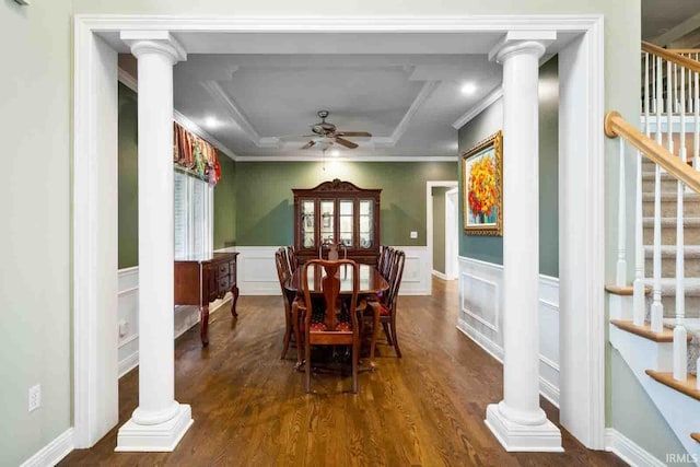 dining room with ornate columns, ceiling fan, crown molding, and dark wood-type flooring