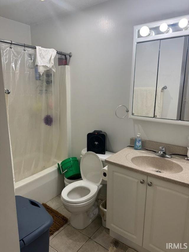 full bathroom with vanity, toilet, shower / bath combination with curtain, and tile patterned flooring