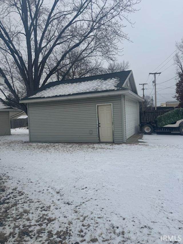 view of snow covered garage