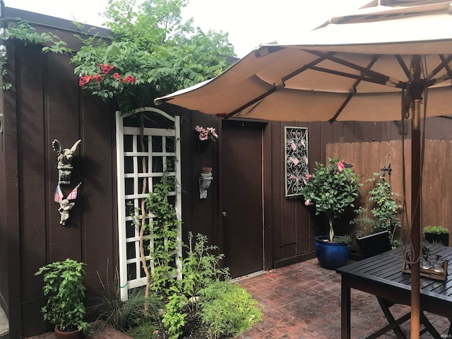 entrance to property with a patio area