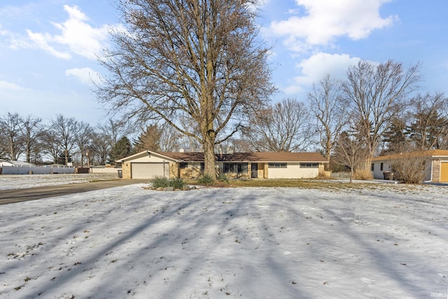 ranch-style home with a garage