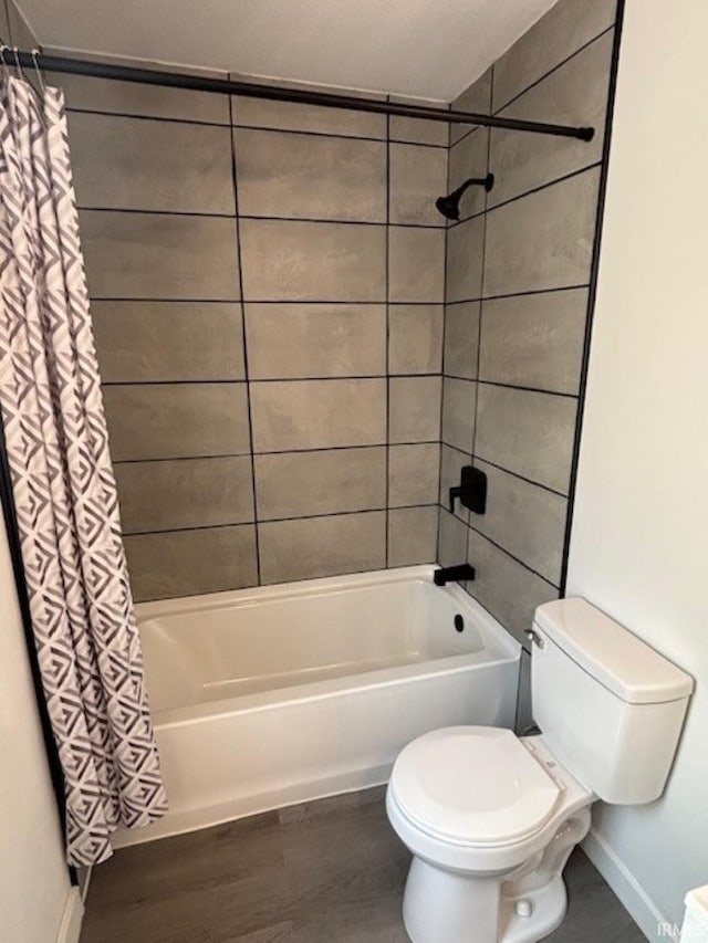 bathroom featuring toilet, shower / bath combination with curtain, and wood-type flooring