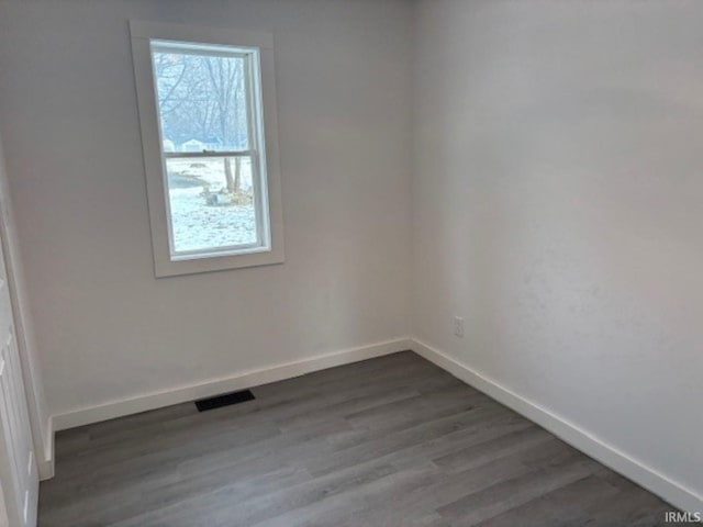 empty room featuring dark hardwood / wood-style floors