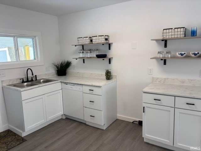 kitchen with sink, white cabinetry, dishwasher, and dark hardwood / wood-style flooring