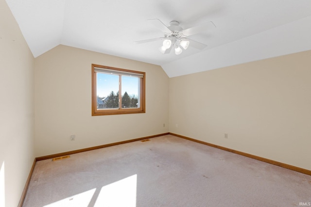 bonus room with ceiling fan, light carpet, and lofted ceiling