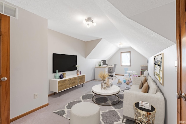 living room featuring light carpet, a textured ceiling, and lofted ceiling