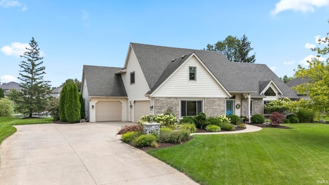 view of front of house featuring a garage and a front lawn