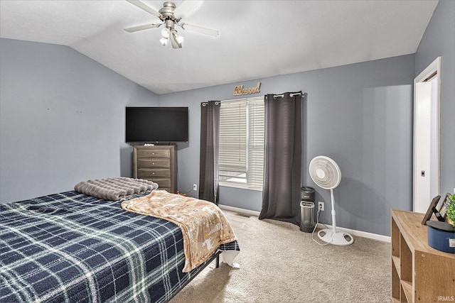 carpeted bedroom featuring ceiling fan and vaulted ceiling