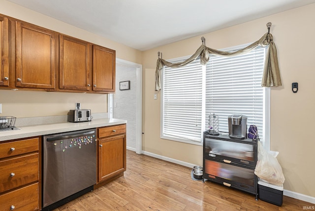 kitchen featuring light hardwood / wood-style floors and dishwashing machine