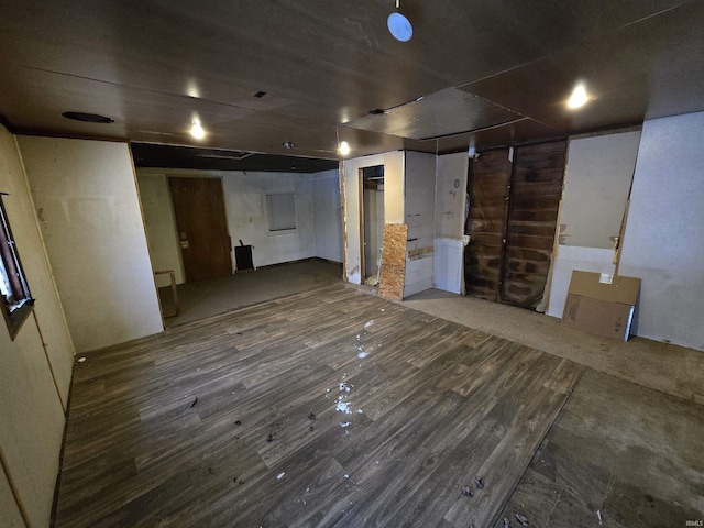 basement featuring dark hardwood / wood-style floors