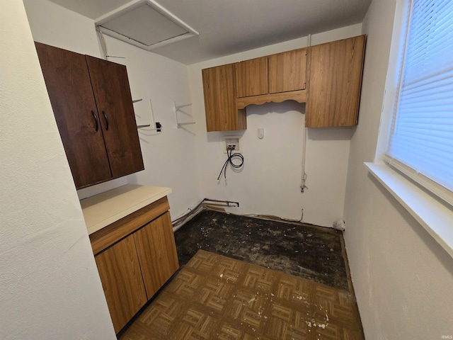 kitchen featuring dark parquet flooring