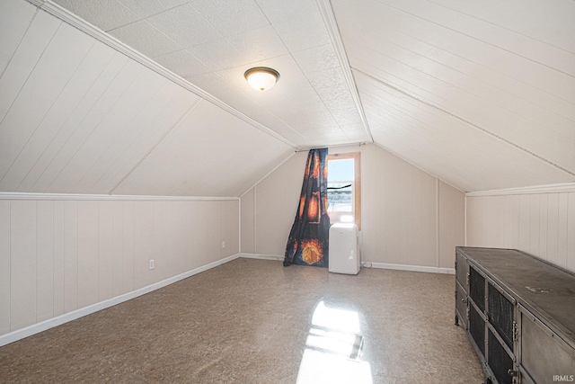 additional living space featuring vaulted ceiling