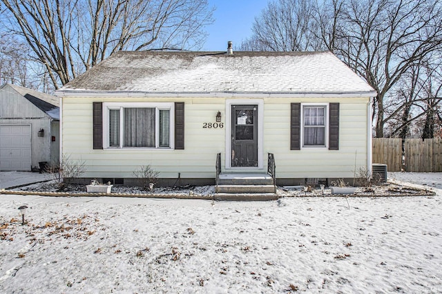 bungalow-style home featuring central AC unit