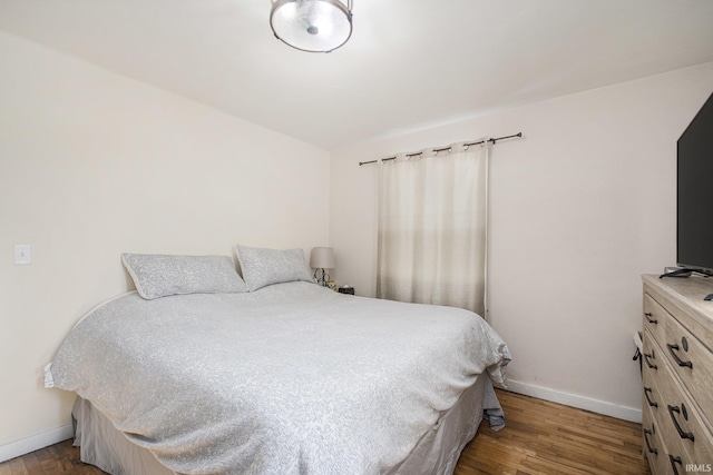 bedroom featuring hardwood / wood-style flooring