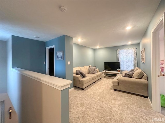 living room featuring light carpet