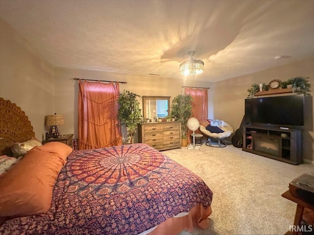 carpeted bedroom with a textured ceiling