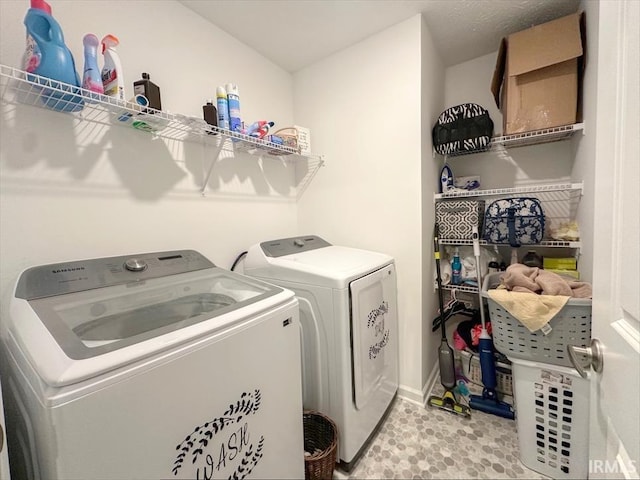 laundry room with independent washer and dryer