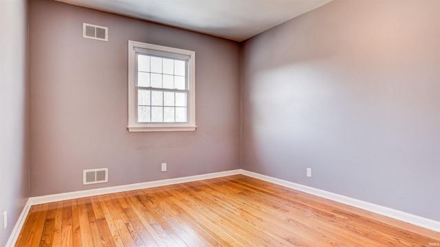 empty room with light hardwood / wood-style floors