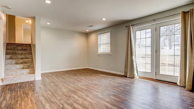 empty room with hardwood / wood-style floors