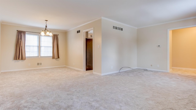 empty room with crown molding, an inviting chandelier, and light colored carpet