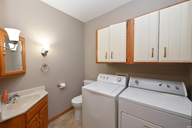 clothes washing area featuring sink and independent washer and dryer