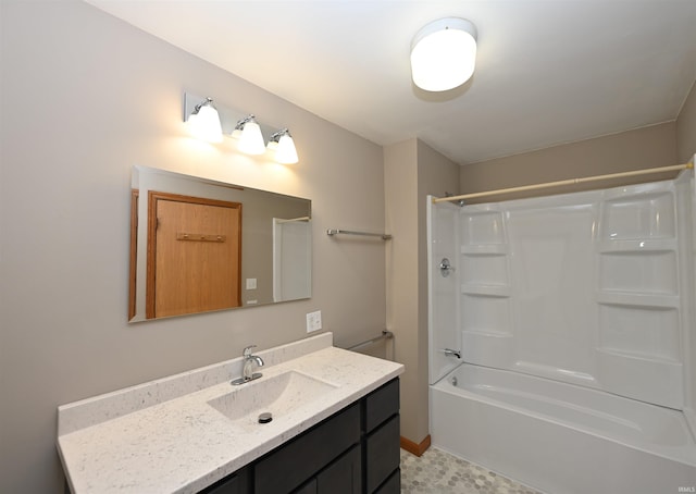 bathroom with shower / bathtub combination and vanity