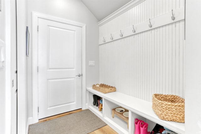 mudroom with light hardwood / wood-style floors and vaulted ceiling